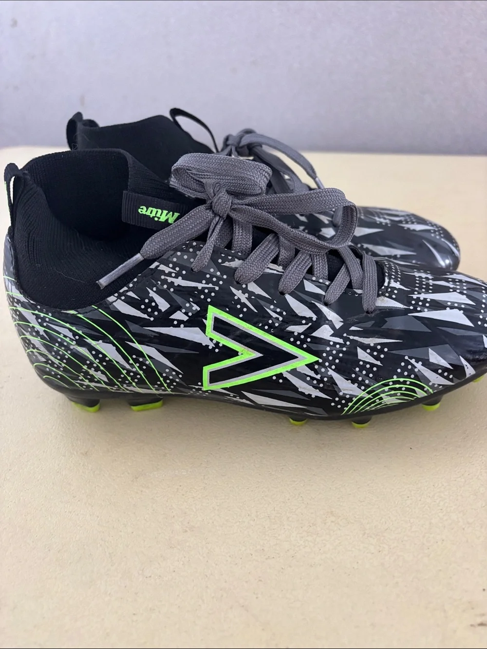Kids' Black Soccer Cleats with Neon Green Accents